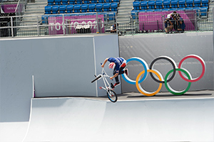 Justin Dowell completes a tailspin in air during the Men's BMX Freestyle seeding. Photo: Casey Gibson