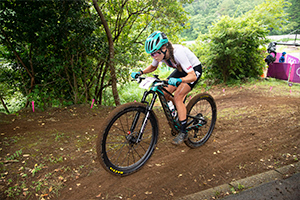 Kate Courtney climbing towards the Chopsticks section of the Women's XC course. Photo: Casey Gibson