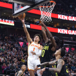 George pushes short-staffed Jazz past Hawks 124-122